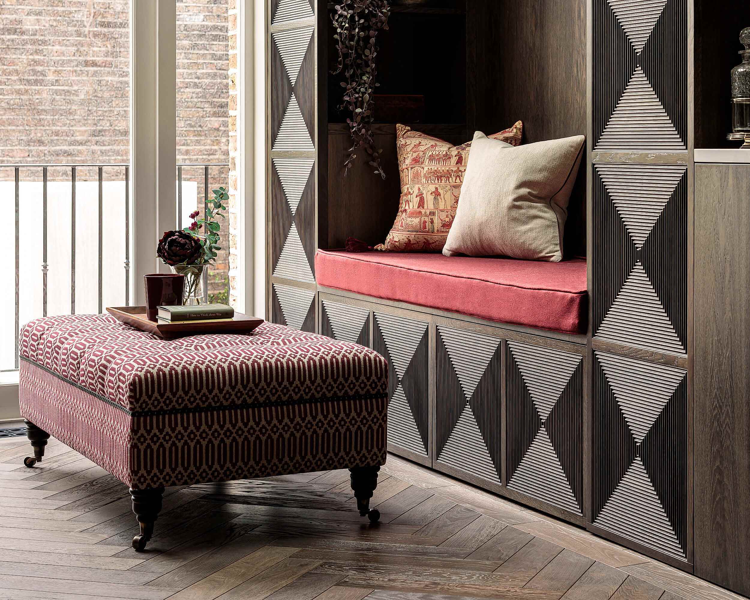 Ottoman storage on herringbone flooring