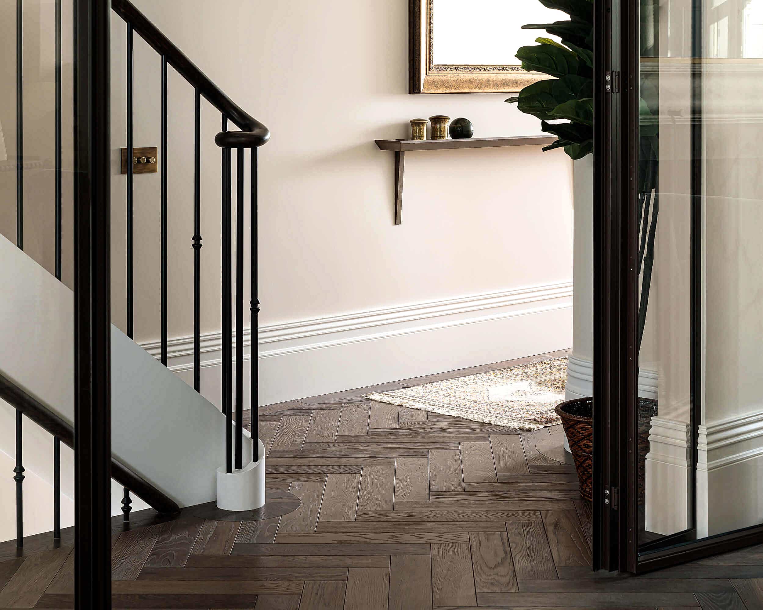 Staircase with Dark Herringbone Flooring