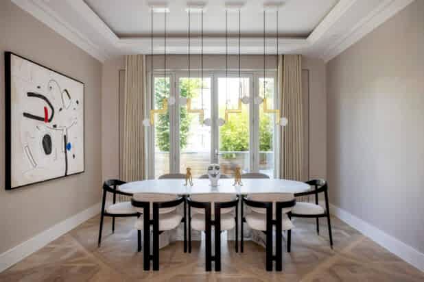 Modern dining room with Versailles panel flooring and abstract wall art